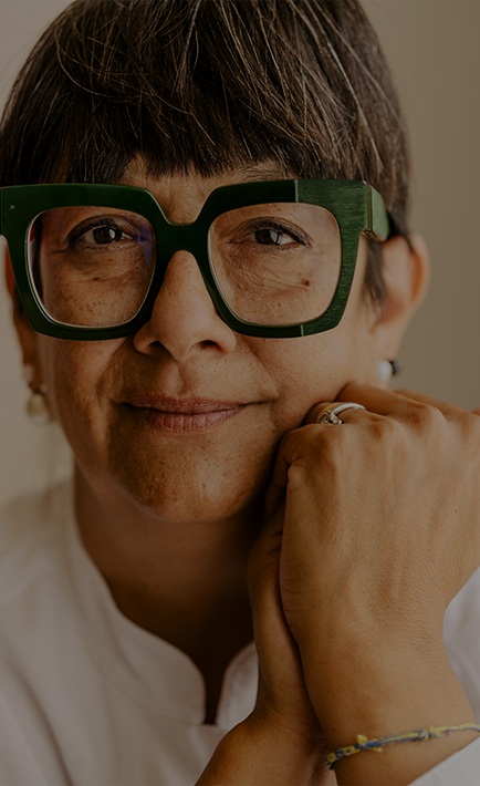 A portrait of a woman wearing glasses.